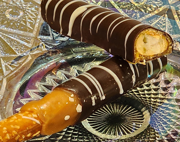 These scrumptious pretzel rods get a generous dip in Sea Salt caramel and then are covered in sweet dark chocolate and then striped with white chocolate!  Approximately 7.5