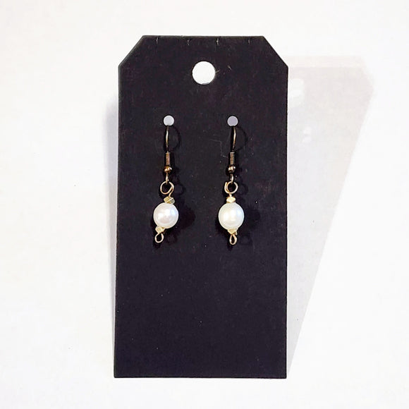We love the simplicity of these pearl drop earrings! The beautiful freshwater pearls hang from antique bronze hardware and are truly perfect for every day.    Approximately 1.5