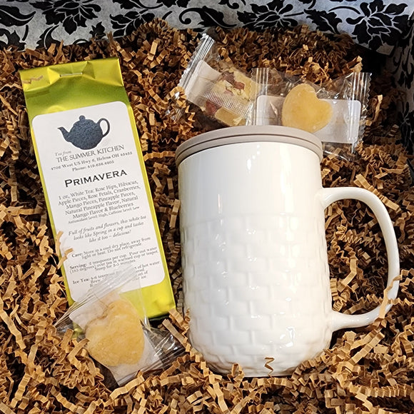 Get or give the gift of TEA!  Inside our Tea-Riffic Tea Box is one of our basket-weave tea infuser mugs, including a stainless steel infuser for your tea and a grey silicone lid to keep it warm while it infuses. We've also included two honey hearts and a honey and goji berry & chrysanthemum honey cube. Then, we have everyone's favorite: Primavera white tea for you to indulge in!  