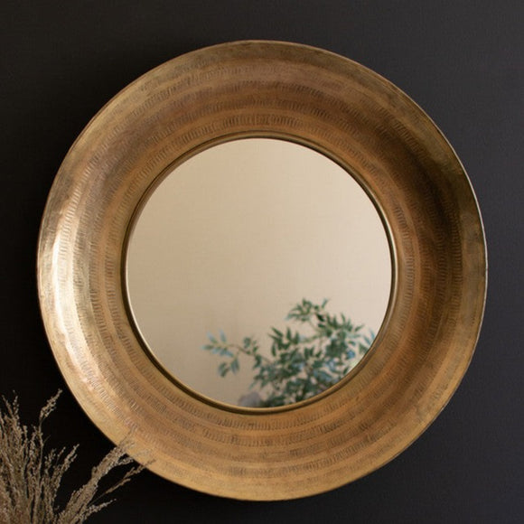 This round mirror with a copper frame, made in India, suits modern and traditional decor styles. It stands out against dark colors or adds depth to neutral walls. Enjoy it in a powder room or above a vanity for extra luxury.  29.5