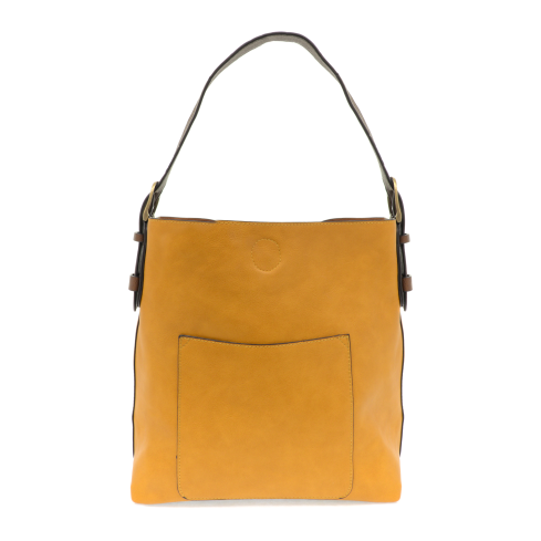 Equally timeless and modern, our best-selling classic hobo is made in rich vegan leather in a beautiful deep berry color, accented with a brown strap.  This roomy bag, accented with a large front pocket and a snap-in removable brown crossbody, has plenty of room to carry your needs in style.   MAIN BAG  12
