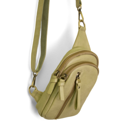 Blending uptown chic with downtown cool, the Skyler sling bag is made in beautiful vegan sage green-colored leather! A convertible strap lends versatility, while a front zip pocket offers practical storage for your necessities. It is the perfect companion for a night out on the town or a fun day trip!   8