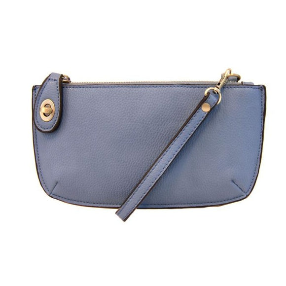 Our most popular bag, in a beautiful chambray color, this mini clutch, with its sleek silhouette, is as gorgeous as it is versatile.  Features include a polished turn lock, six card slots, and an interior zipper for change.  It can be styled in many ways, with removable straps to alternate between wallet, crossbody, and wristlet!   5