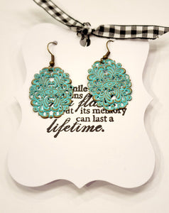 These beautiful oval fillagree earrings are Heavily textured and oh-so lightweight!  Hand Painted in mint and then distressed. Nickel-free, Lead-free.  Measure 2" tall by 1" wide.