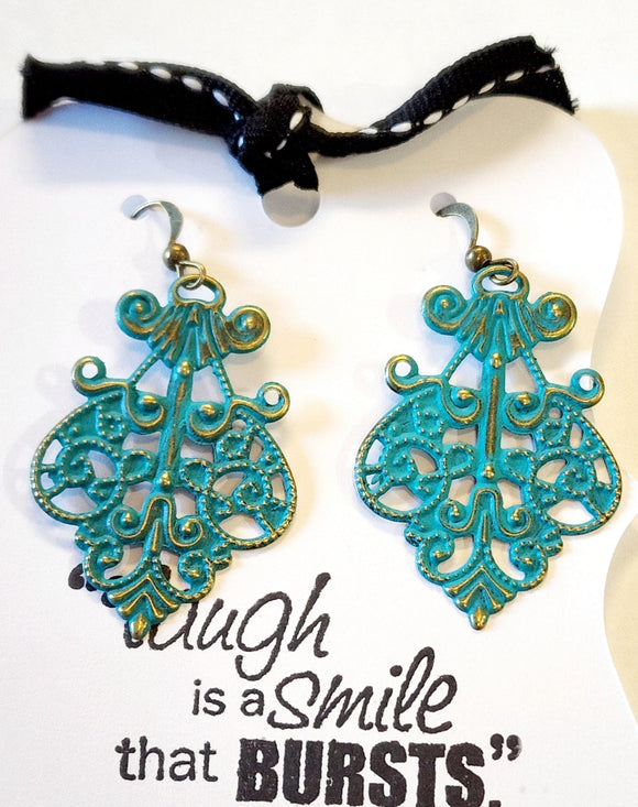 What does a modern girl wear to the ball? These little earrings will make any day feel special!  Painted in an aqua finish and distressed.  Filigree measures 1 1/2