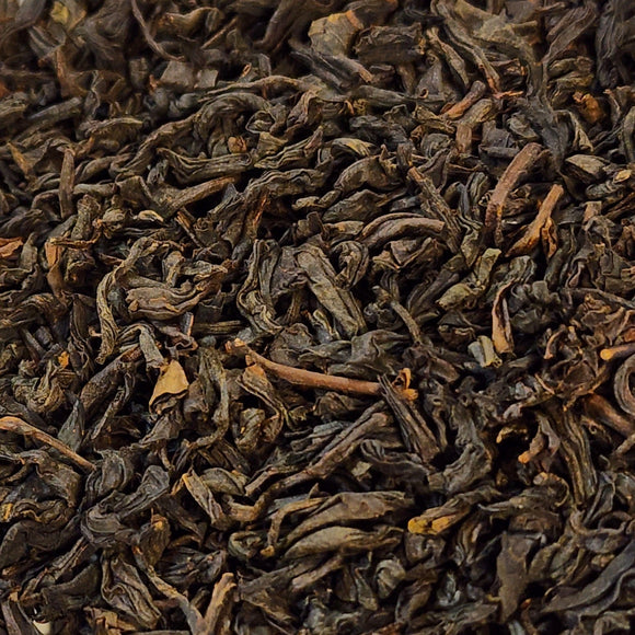 This large-leaf smoked tea from China is legendary. It was a favorite of Winston Churchill and is the perfect tea for sitting by the fire while reading a good book. It is bold, smoky, and smells of campfire & cool mornings. Enjoy a splash of maple syrup to sweeten it!  2 oz Premium Black Tea