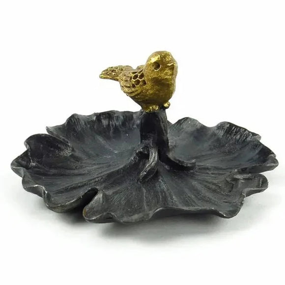This sweet leaf-shaped pewter dish has a gold bird figurine perched on top. A perfect place to put rings and earrings in at the end of the day!  4.25