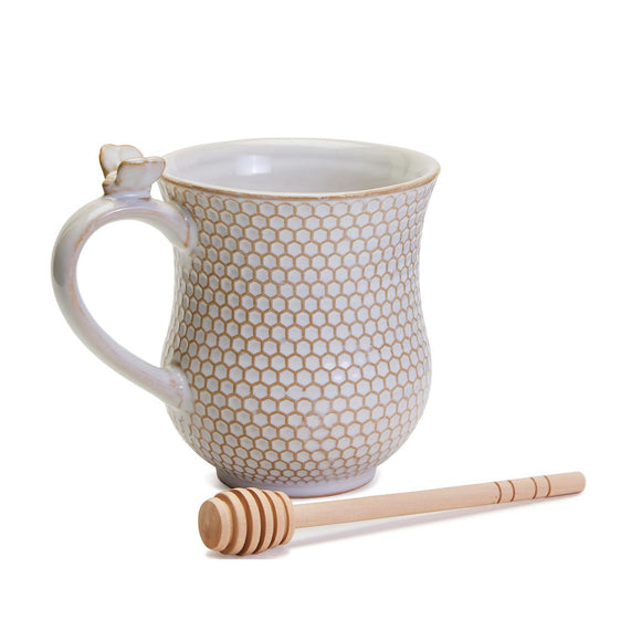 Now isn't this the sweetest thing you've seen?  Our Honeycomb raised pattern has a white glaze and on the top of the handle is a ceramic bee.  Included is a honey dipper that gathers your honey and then can stir the honey into your tea!  So adorable, you'll enjoy drinking out of it every day!  16 oz. stoneware mug dishwasher and microwave safe.  Dipper/Stirrer (schima wood) hand wash only  Mug: 5 3/4