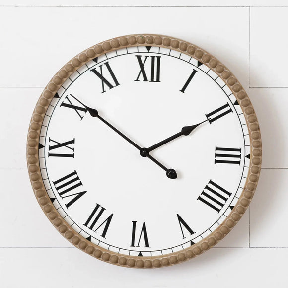 We love this clock with its white background and black roman numeral numbers! The wood detail along the outside of the clock and the beaded front will make quite a statement on your wall.  16.5