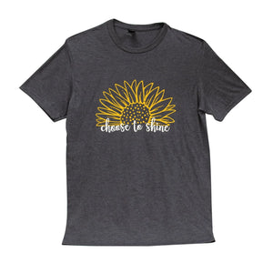 We love our new charcoal t-shirt!  A yellow sunflower with the words "choose to shine" is in a sweet cursive print below. These are so soft & comfy, that you will love wearing them to football games, bonfires or just running around doing errands. The styling possibilities are endless. Roll up the sleeves, tie a side knot, front tuck, or wear it while lounging around the house. We guarantee that you will love the fit and the softness of this shirt.