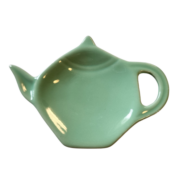 Get one of our cute retro-inspired teapot-shaped tea bag holders to help keep the drips from your teabags from going anywhere!  Aqua, single glaze lead-free ceramic ware.  Approximately 5