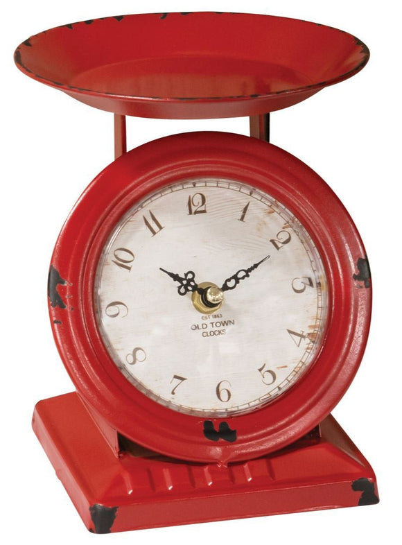 Add a fun pop of color to a room a breeze with our distressed Red Scale Clock! It is the perfect size to be displayed on kitchen counters, islands, or in dining rooms, and it looks fantastic paired with flowers, candles, and more!  Measures 6.75” H x 5.5” W x 5” D  Requires 1 AA battery, not included.