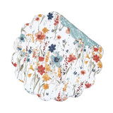 This placemat is such a fun &amp; fresh pattern for your table! Create an eye-catching display with its watercolor wildflowers of vivid coral, yellow, aqua, and blue. This cotton placemat reverses to an abstract aqua and white floral pattern for a more subdued statement.&nbsp;Crafted of cotton and machine washable for easy care. Finished with a scalloped edge, this placemat is crafted of 100% cotton and hand-guided machine quilting.