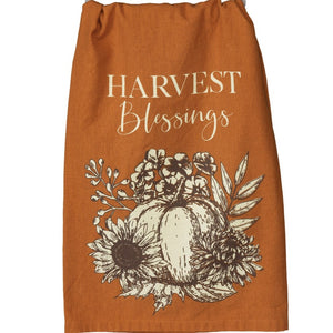This pretty burnt orange cotton kitchen towel has the words "Harvest Blessings" in a mixed font above neutral botanicals surrounding a pumpkin.  Machine-washable.  28" x 28"