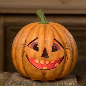This perky pumpkin has vintage-style printed vellum inserts with an opening in the bottom for a battery-operated light. Light him up for a glowing good time!  Paper mâché & velum  Approximately 9"t  x 8"w