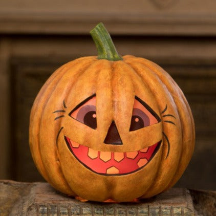 This perky pumpkin has vintage-style printed vellum inserts with an opening in the bottom for a battery-operated light. Light him up for a glowing good time!  Paper mâché & velum  Approximately 9