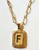 These initial necklaces are one of the hottest looks for this season!  Gold-plated rectangle initial charm with the letter "F" on it comes on a paper clip chain that is 18" long with a 2" extender and a lobster clasp closure.  Made in the USA.