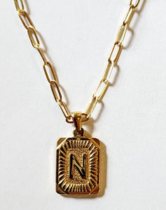 These initial necklaces are one of the hottest looks for this season!  Gold-plated rectangle initial charm with the letter "N" on it comes on a paper clip chain that is 18" long with a 2" extender and a lobster clasp closure.  Made in the USA.