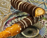 These scrumptious pretzel rods get a generous dip in Sea Salt caramel and then are covered in sweet dark chocolate and then striped with white chocolate!  Approximately 7.5" long