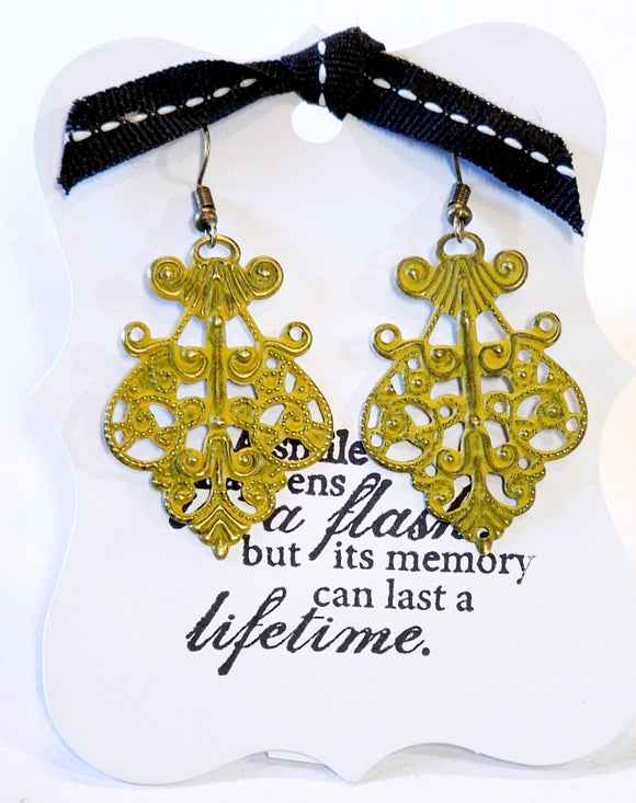 What does a modern girl wear to the ball? These little earrings will make any day feel special!  Painted in a  citron yellow finish and distressed.  This filigree earring measures 1 1/2