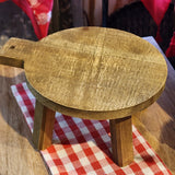 This distressed wooden stool is perfect for setting a plant, small lamp, or cute vignette on!  If you need to give something some height to your decor, this little stool will help you do just that!  Round top.  4.5" H x 9.5" L, 7.75"D