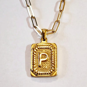 These initial necklaces are one of the hottest looks for this season!  Gold-plated rectangle initial charm with the letter "P" on it comes on a paper clip chain that is 18" long with a 2" extender and a lobster clasp closure.  Made in the USA.