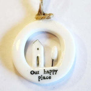 This little circular porcelain gift tag is sure to bring a little happiness to you or someone you give it to!  Inside the cut-out is a house and tree; below it is the word "Our Happy Place." This makes a great gift for a new home owner! A jute rope is attached at the top for hanging.  1 1/4" Dia