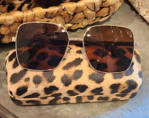 You'll absolutely love the looks of our gold metal-framed sunglasses!  Included is our animal print hard case to keep your sunglasses in!  2"L x 5 1/2"W x 1"H   Metal/Polycarbonate