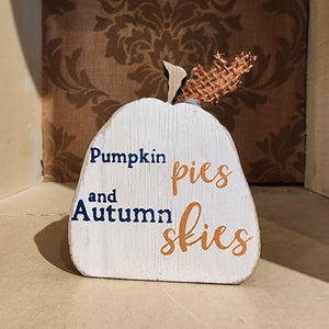 So fun to mix in with your other fall decor, this white wooden pumpkin has the words "pumpkin pies and autumn skies" in a mixed font on the front of the pumpkin.   3.5" H x 2.75" W x .75" D