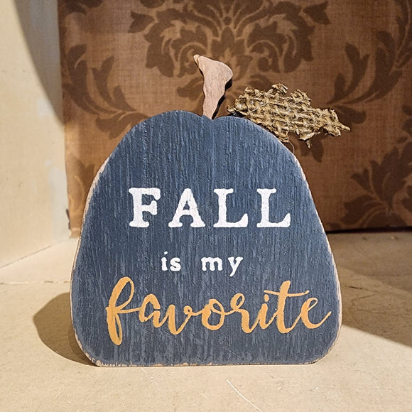 So fun to mix in with your other fall decor, this black wooden pumpkin has the words 