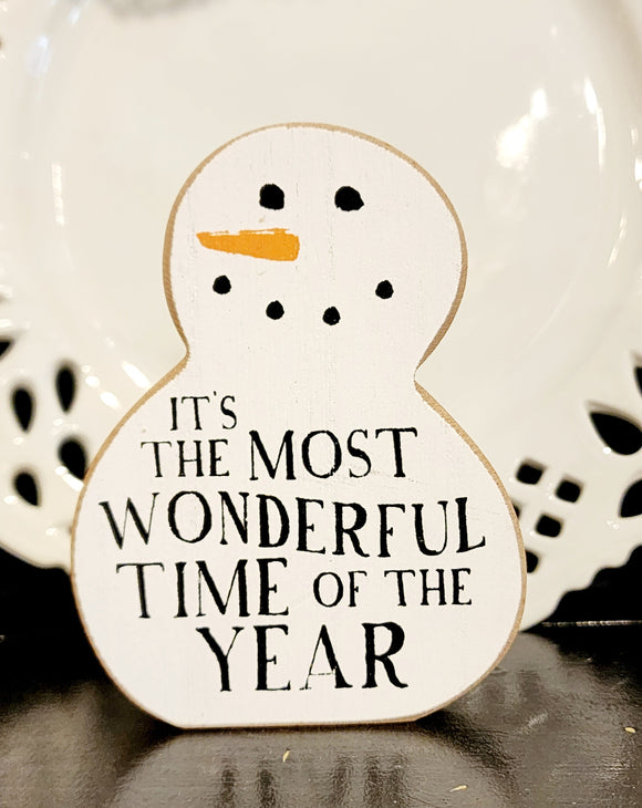 Bring dreams of a white Christmas a little closer to the farmhouse this year with this cute chunky snowman sitter!  White, with raw edges, this wooden snowman has a cute smile, orange carrot nose and 