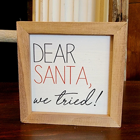 This sign tells it like it is, sorry Santa!  This will be too cute wherever you choose to put it this holiday season!  It is made from high-quality American hardwood planks with a hand-painted face, printed with UV-cured ink, and framed in a natural walnut frame. Each piece is unique with its own personality, marks, wood grain, and look. Easy to clean with a dry cloth.  Made in the USA  4