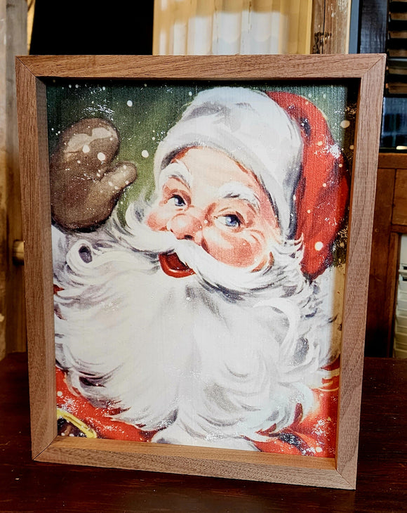 Santa is sure happy to see you this year. Just look at him wave!  We can almost see his eyes twinkling....how about you? The green background makes the snow pop.  Why don't you bring a bit of nostalgia to your decor this year with this artwork?