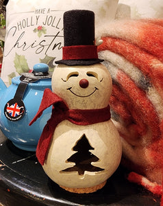 This cute gourd snowman is white in color with a red scarf and red nose.  He has a handcrafted face and tree design.  It is approximately 3" in diameter and 6" tall.  It can be lit by purchasing a battery-operated tea light.  Warning: Gourds are flammable. Do not use candles in them or place them near open flames.