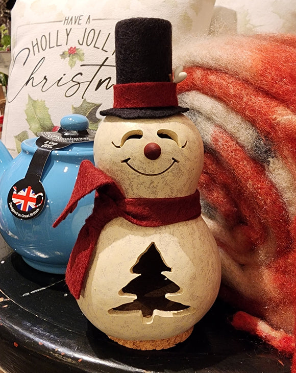 This cute gourd snowman is white in color with a red scarf and red nose.  He has a handcrafted face and tree design.  It is approximately 3