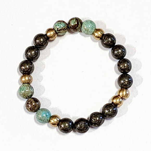Wear one or stack them high. Our Gemstone Stretch Beaded Bracelets go with anything. Beautiful blue turquoise and pyrite beads are threaded on a stretch band with six gold beads.   We want your jewelry to last. Therefore, we do not recommend swimming, showering, or applying cosmetics or perfumes.