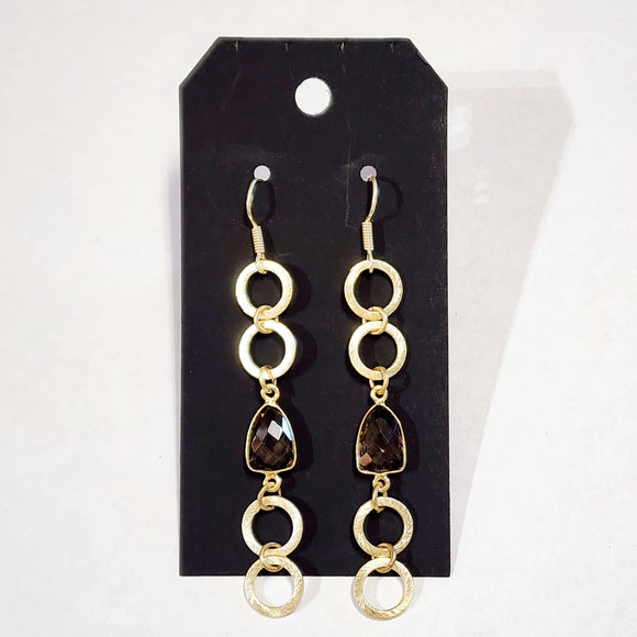 These delicate earrings have four brushed gold circles with a topaz-colored gem in the center of the chain of circles ~ absolutely stunning!  Approximately 3.5