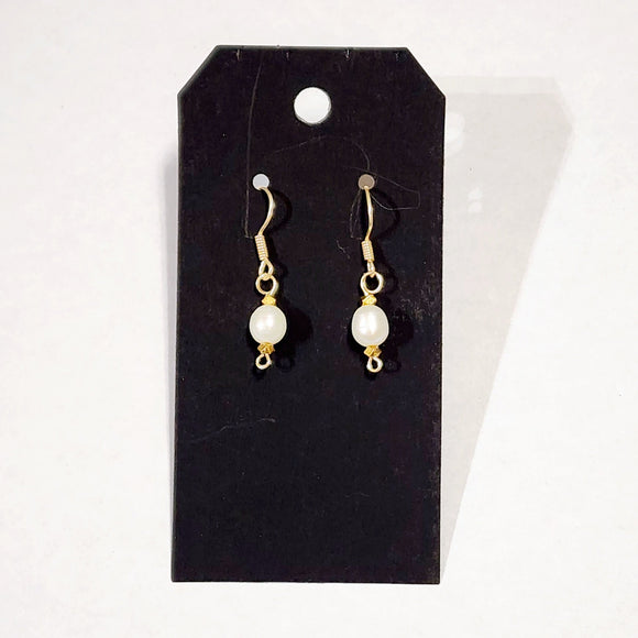 We love the simplicity of these pearl drop earrings! The beautiful freshwater pearls hang from gold hardware and are truly perfect for every day.    Approximately 1.5