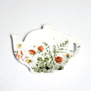 This adorable teapot shape tea bag holder has a pretty floral with strawberries in a delicate watercolor style on a white background.  Microwave, dishwasher, and food-safe for convenient use.  Stoneware  4.5" x 3.5" x 1/2"