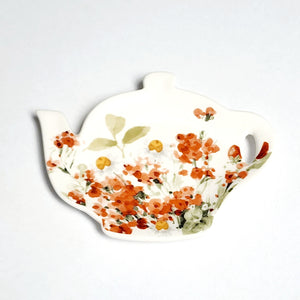 This adorable teapot shape tea bag holder has a pretty wildflower design featuring poppies in a delicate watercolor style on a white background.  Microwave, dishwasher, and food-safe for convenient use.  Stoneware  4.5" x 3.5" x 1/2"