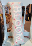 What a sweet vintage vibe this "Bloom" pillow has!  The word Bloom is in a white chenille on top of the prettiest little rose pattern on a blue background.    6" H x 18" W  Cotton
