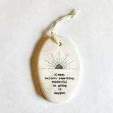 <p><span data-mce-fragment="1">This oval-shaped porcelain ornament is perfect to give to someone to let them know you are thinking of them! The words "Always believe something wonderful is going to happen" are below a sun rising.</span></p> <p><span data-mce-fragment="1">2 1/4" W x 3 1/4" H</span></p>
