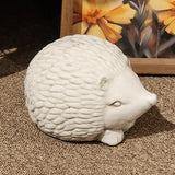 <p>This hedgehog has a distressed white finish and is made of concrete and is too cute! He can be put inside or outside.<span></span></p> <p>Approximately 6" W x 4.5" H x 3.5" D</p>