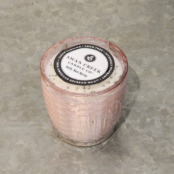 You'll love our newest candle style & size! This salty sea spray candle has been poured into a pretty basketweave pink glass.
