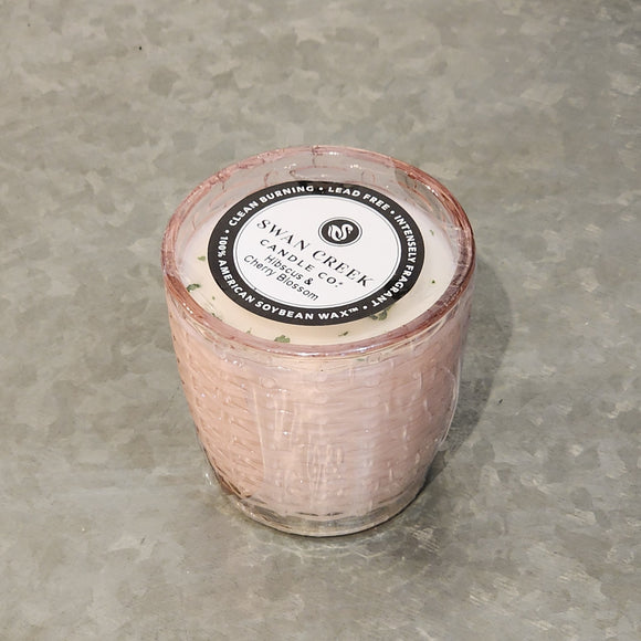 You'll love our newest candle style & size! This hibiscus & cherry blossom candle has been poured into a pretty basketweave pink glass.