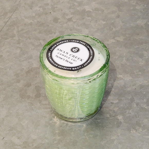 You'll love our newest candle style & size! This farmer's market candle has been poured into a pretty basketweave of green glass.