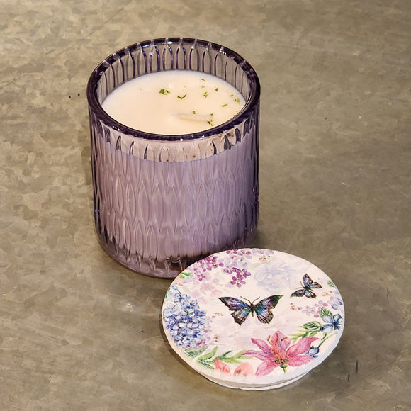<p><span>You'll love our newest candle style and size! This Italian Countryside candle has been poured into a pretty basketweave lavender glass with a butterfly or hummingbird lid.</span></p> <p>Wild blueberries, red raspberries, peach, and strawberry fuse together with fresh coconut, condensed milk, orange zest, and sweet cream for a bright buttery berry confection!</p>