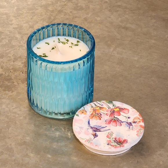 <p><span>You'll love our newest candle style and size! This summer melon candle has been poured into a pretty blue patterned glass and comes with either a butterfly or hummingbird lid.</span></p> <p><span>Honeydew and watermelon both come together to create this refreshing summery fragrance!</span></p>