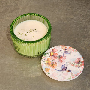 <p><span>You'll love our newest candle style and size! This honey soaked apples candle has been poured into a pretty green-</span><span style="font-size: 0.875rem;">patterned glass and comes with a butterfly or hummingbird lid.</span></p> <p><span>Pure, Crisp and Refreshing. Mild honey notes with a pure, crisp apple body for a high throw.</span></p>