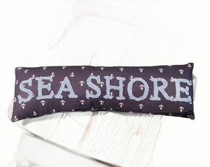 <p>This adorable mini pillow will make you smile every time you SEA it, lol!&nbsp; There are little white anchors, all of the navy fabric.&nbsp; Across the front is "SEA SHORE" in a light blue chenille.&nbsp; It will SHORE look nice in your home, giving a fun coastal vibe!</p> <p><span>6" H x 18" W</span></p> <p><span>Cotton, Polyester Fiber</span></p>